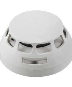Schneider Electric Esmi Impressia värmedetektor, vit Vit, rund värmedetektor med ventilationsöppningar och slät ovansida, avbildad från sidan.
