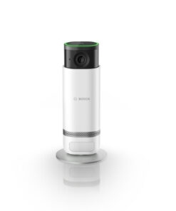 Bosch Eyes inomhuskamera II - hemmasäkerhet med stil Vit cylindrisk Bosch inomhuskamera med svart topp och silverfärgad botten. Kameran står på en bas mot en vit b...